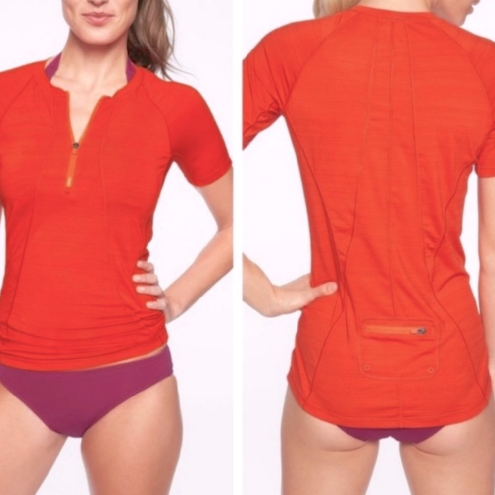 Athleta short sleeve zipper Red Rashguard with back pocket. Size Medium